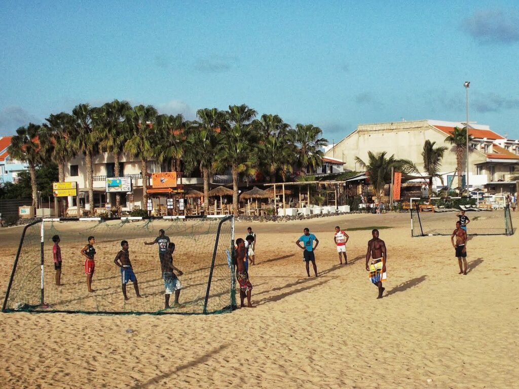 Boys playing soccer on the beach of Santa Maria on the island of Sal, Cape Verde