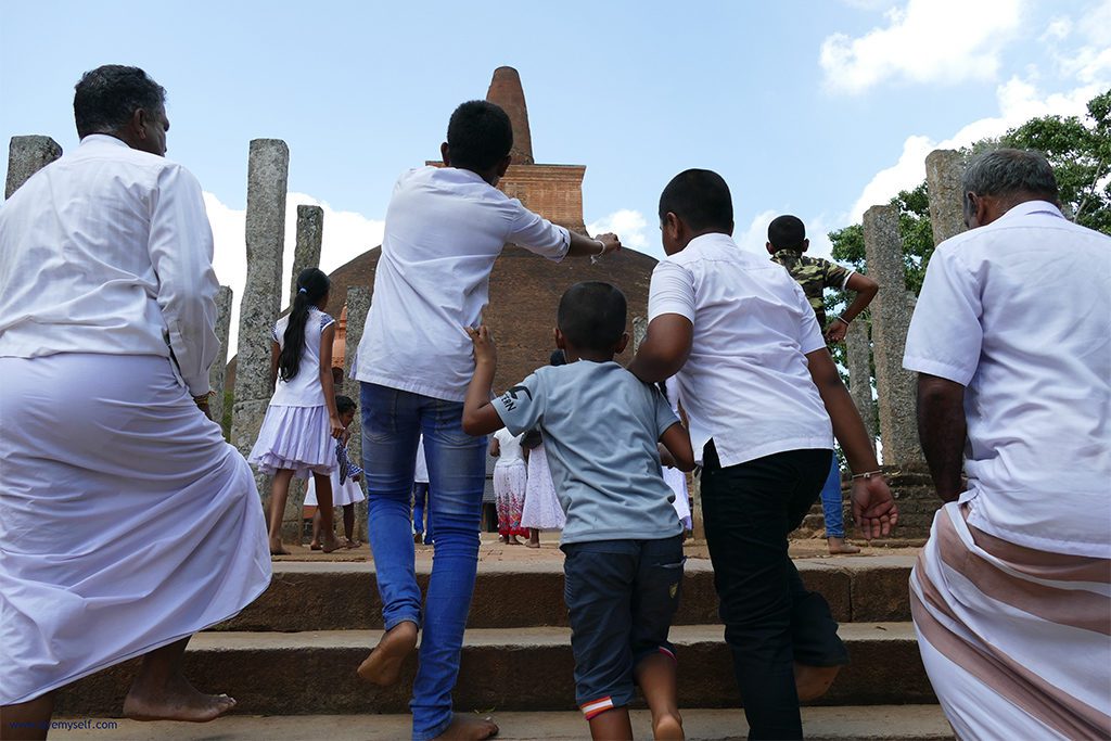 Faithful rushing to the Abayagiri Dagaba in Anuradhapura Sri Lanka